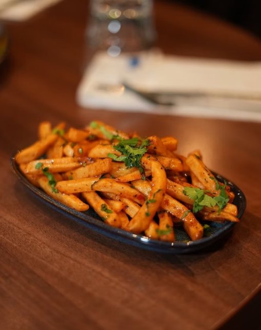 Masala chips tossed with chilli and fresh coriander at Zaiqa London