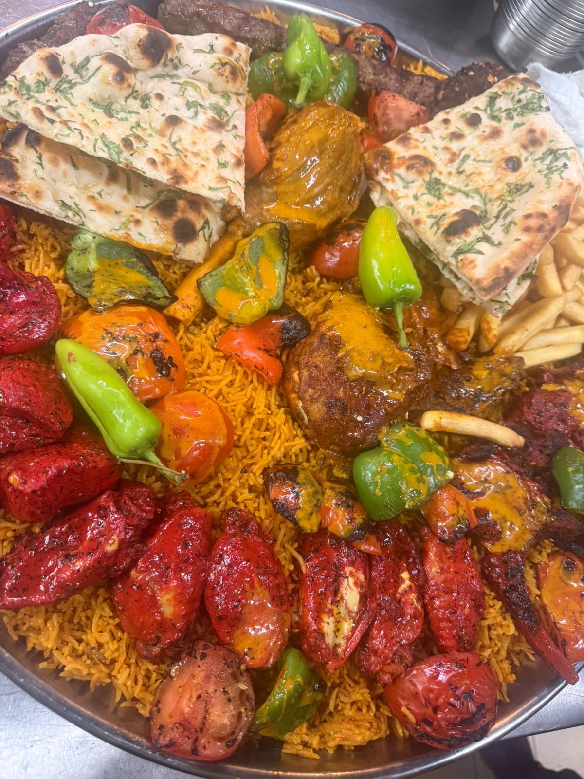 Mixed grill sharing platter with fresh naan at Zaiqa London
